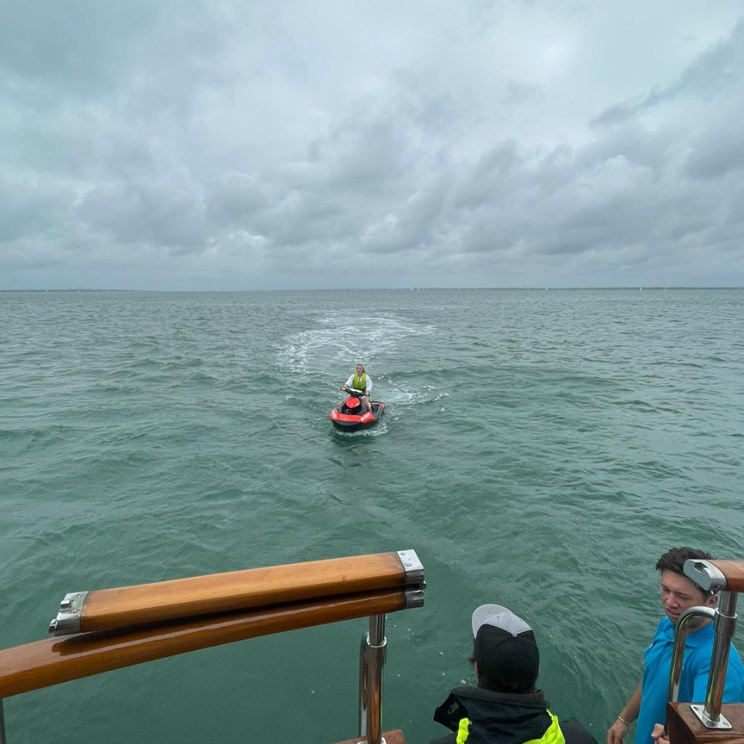 Photo of a person on a jet ski taken from the boat.