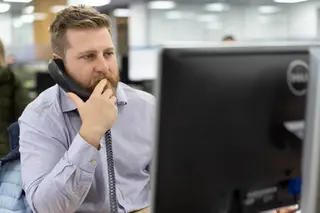 Photo of team member using the telephone