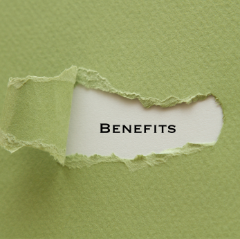Green paper torn back to reveal the word "Benefits" printed on white paper underneath.